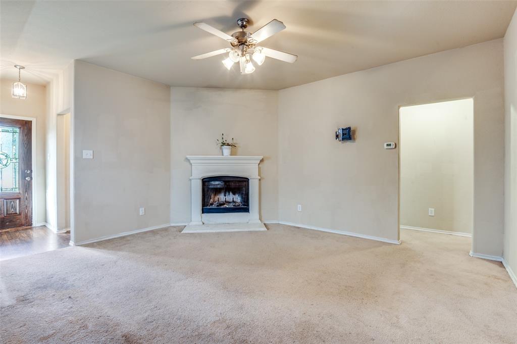 4040 Golden Rod Drive Forney, TX 75126 - Photo 5 of 25 a view of an empty room with a fireplace