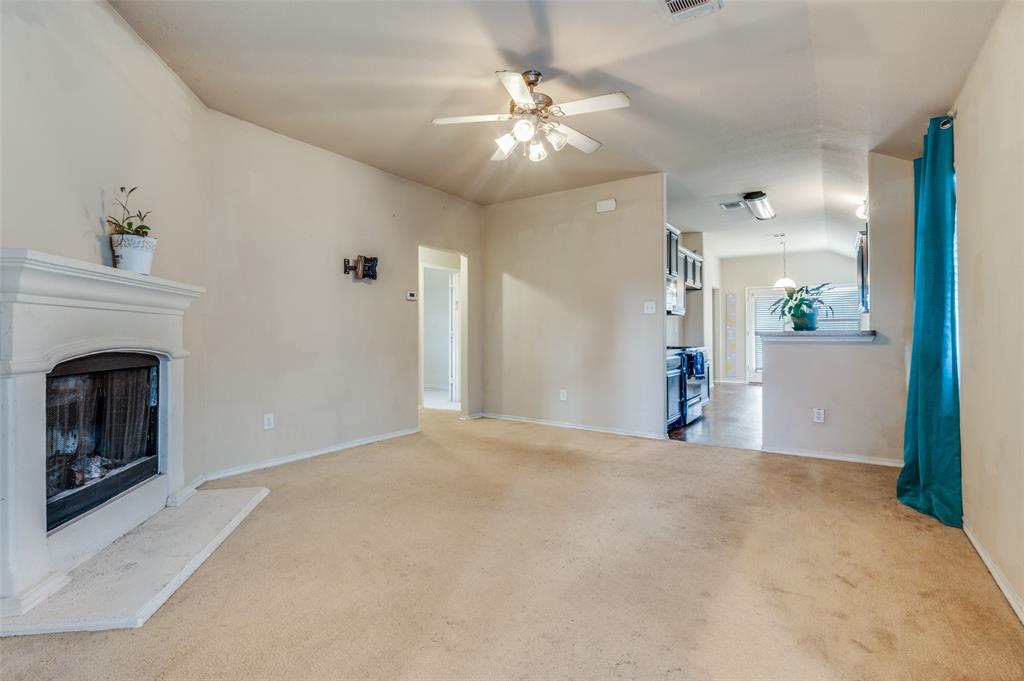 4040 Golden Rod Drive Forney, TX 75126 - Photo 6 of 25 a view of a livingroom with a fireplace
