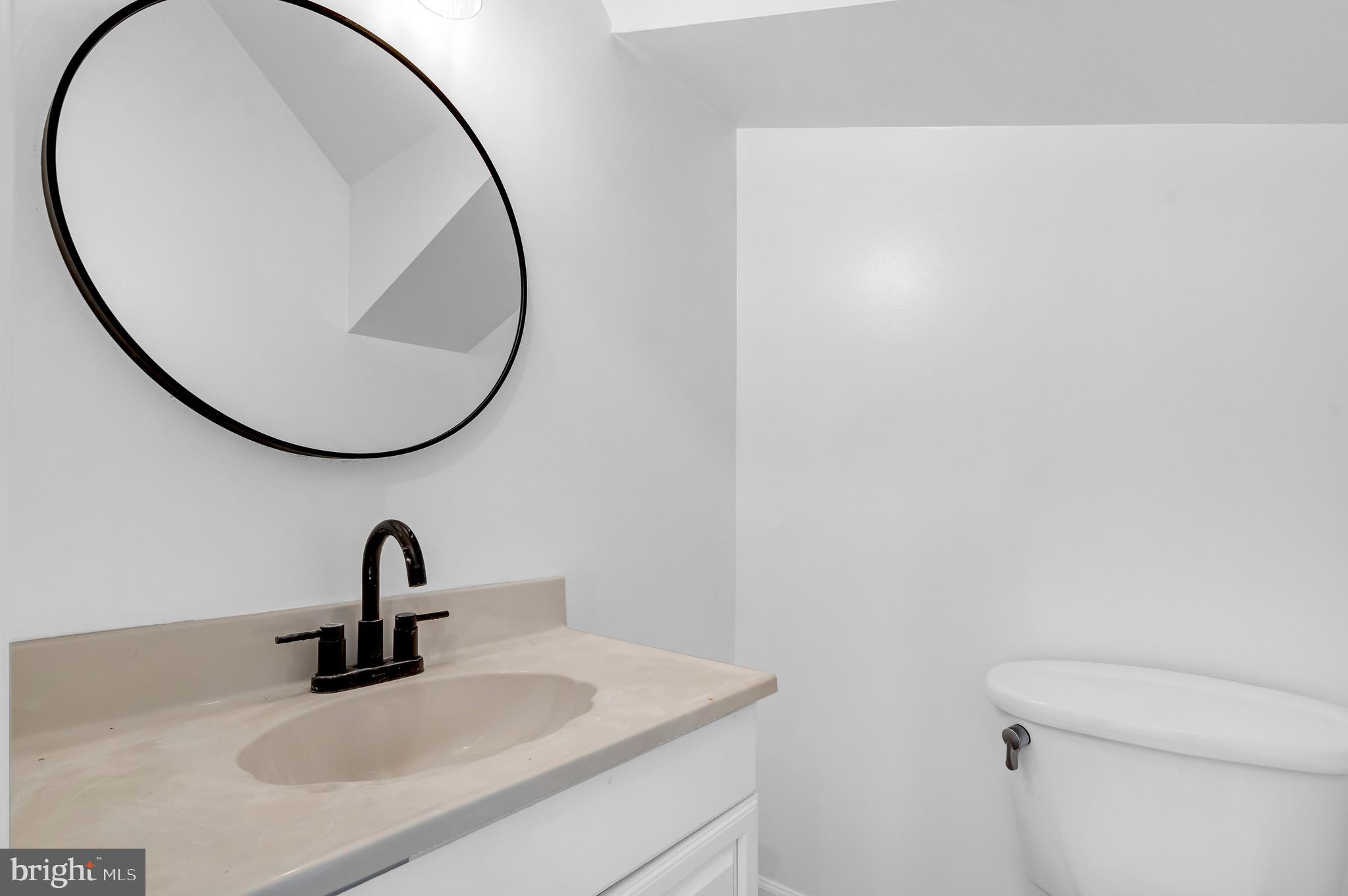 1749 L Street Northeast Washington, DC 20002 - Photo 11 of 24 a bathroom with a sink and a mirror