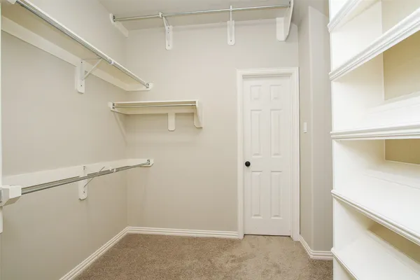 a spacious bathroom with a sink a mirror a bathtub and shower