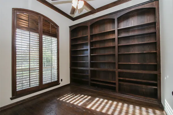 a view of a room with wooden floor