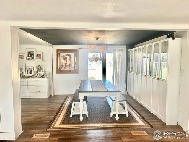 a view of living room with furniture and window