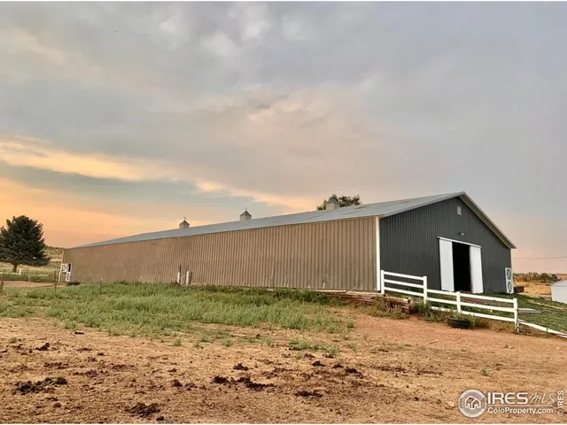 a backyard of a house with basket ball court