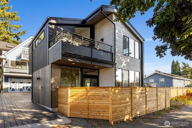 a view of a house with large windows