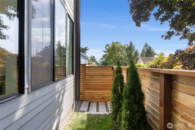 a view of a balcony with a potted plants