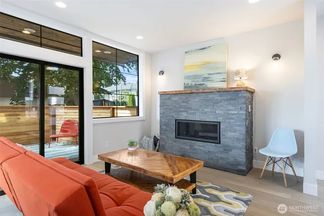 a bedroom with furniture and a fireplace