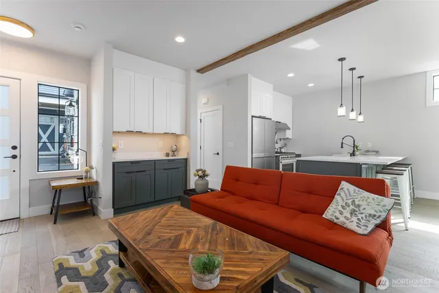 a bedroom with a bed a couch and a dresser