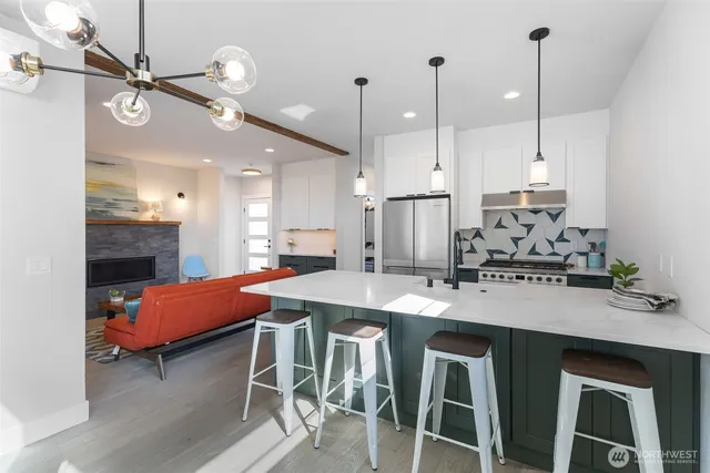a large kitchen with a table and chairs
