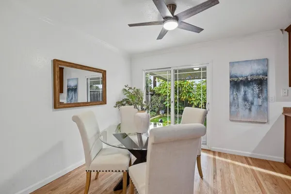 a dining room with furniture and window