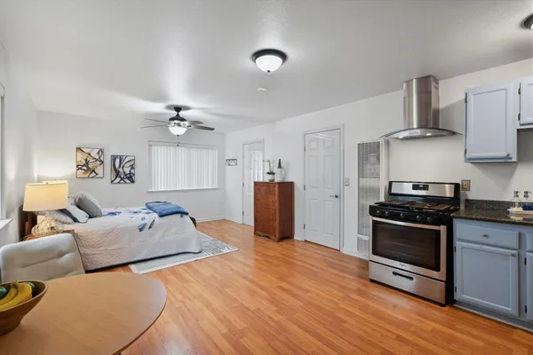 a kitchen with stainless steel appliances granite countertop a stove and a refrigerator