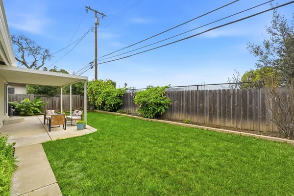 a front view of house with yard and seating area