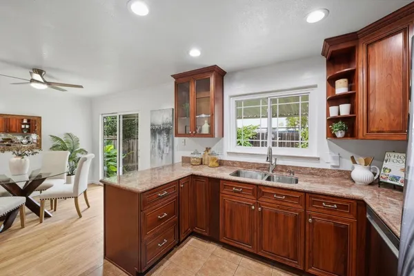 a kitchen with a sink stove and cabinets