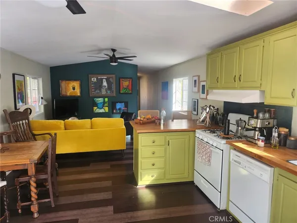 a kitchen with a sink cabinets and window