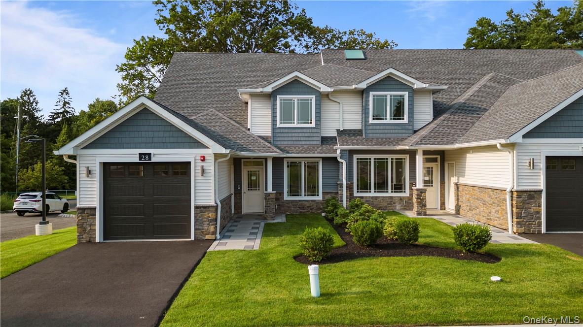 16 Dessau Circle Spring Valley, NY 10977 - Photo 2 of 32 a front view of a house with a yard and garage