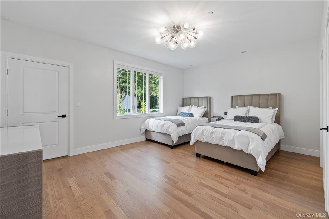 16 Dessau Circle Spring Valley, NY 10977 - Photo 22 of 32 a bedroom with bed and a window