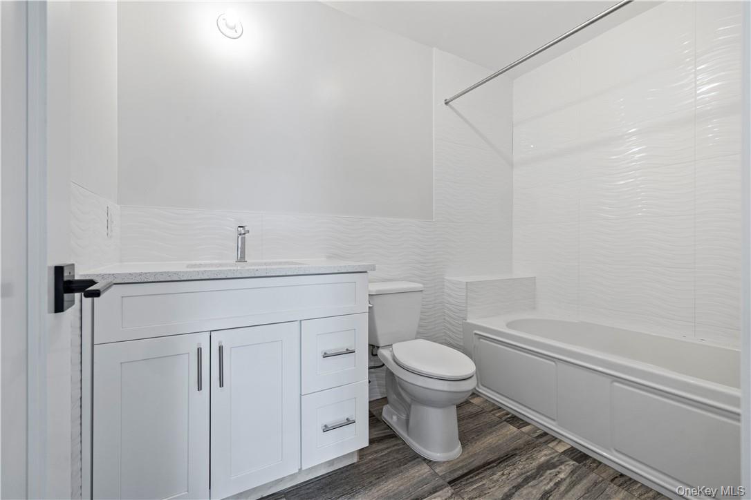 16 Dessau Circle Spring Valley, NY 10977 - Photo 29 of 32 a bathroom with a sink toilet and shower