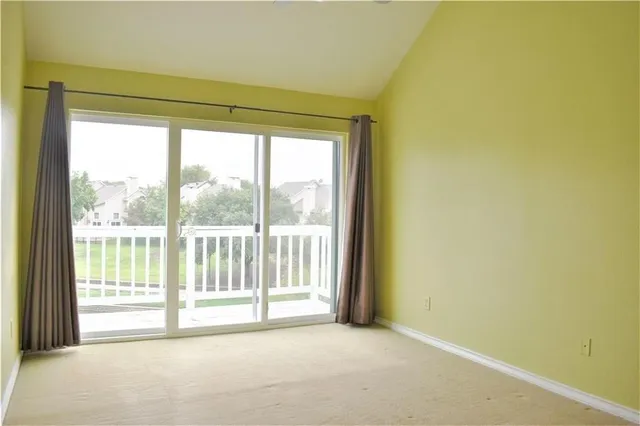 a view of a room with a large window