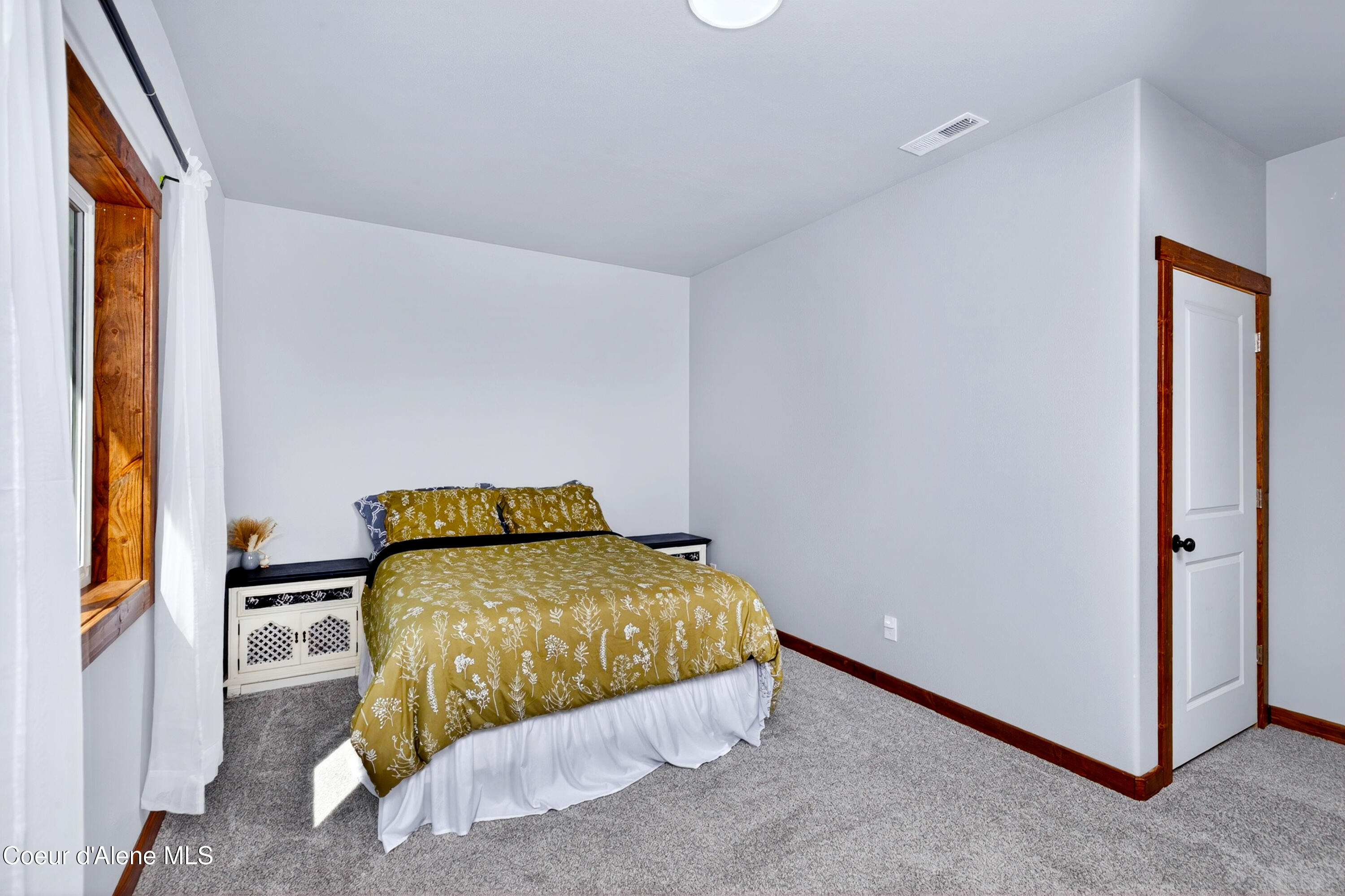 334 Hardy Loop Bonners Ferry, ID 83805 - Photo 12 of 33 011_Secondary_Bedroom_Main_View