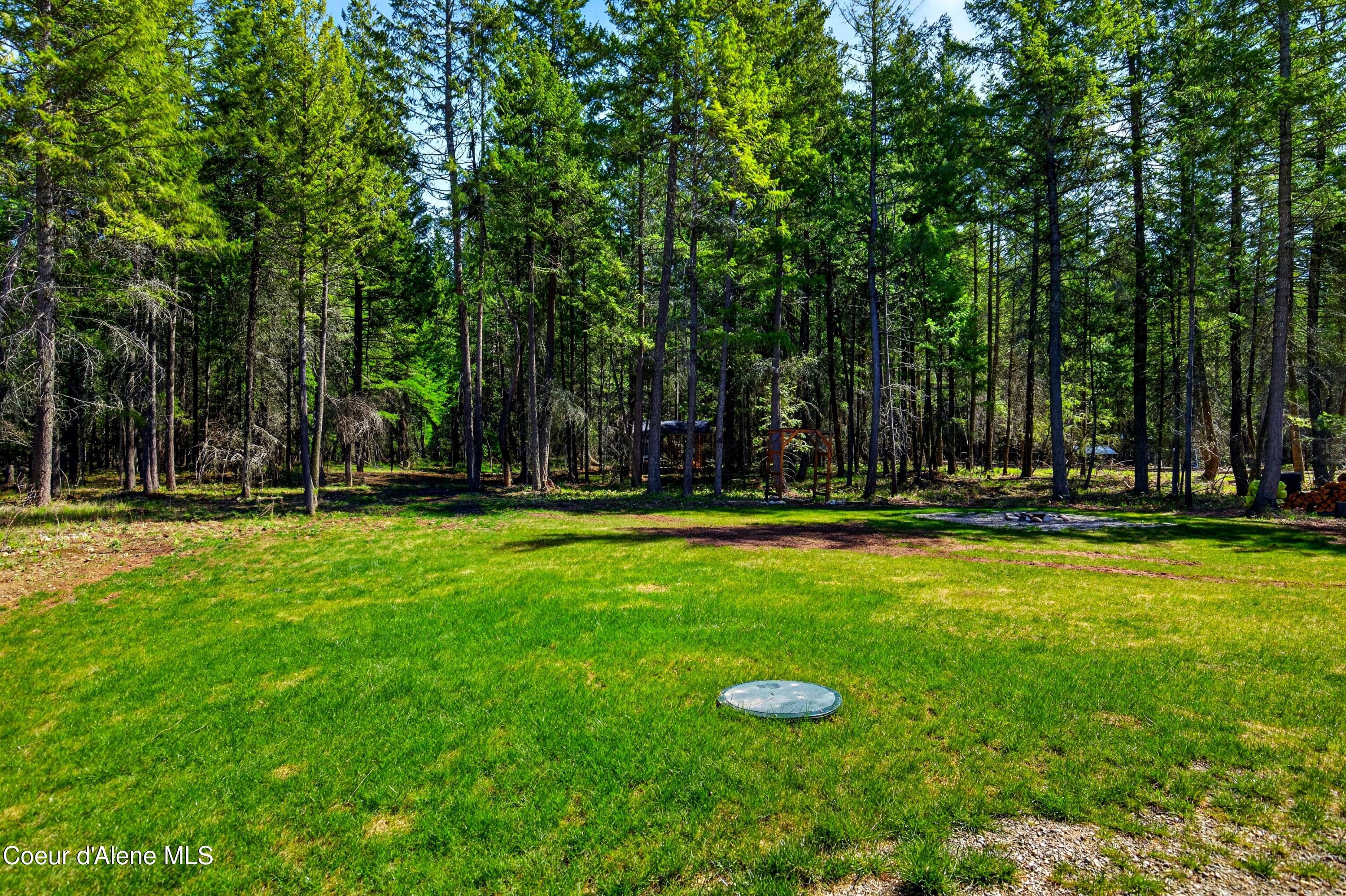 334 Hardy Loop Bonners Ferry, ID 83805 - Photo 24 of 33 023A_Backyard_Open_Lawn