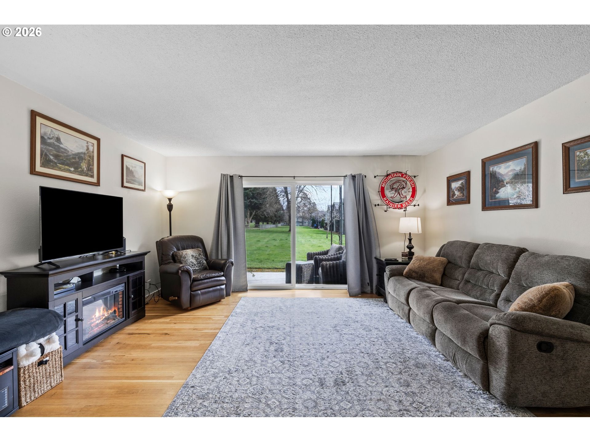 1773 Northeast 19th Street Gresham, OR 97030 - Photo 3 of 18 a living room with furniture and a flat screen tv