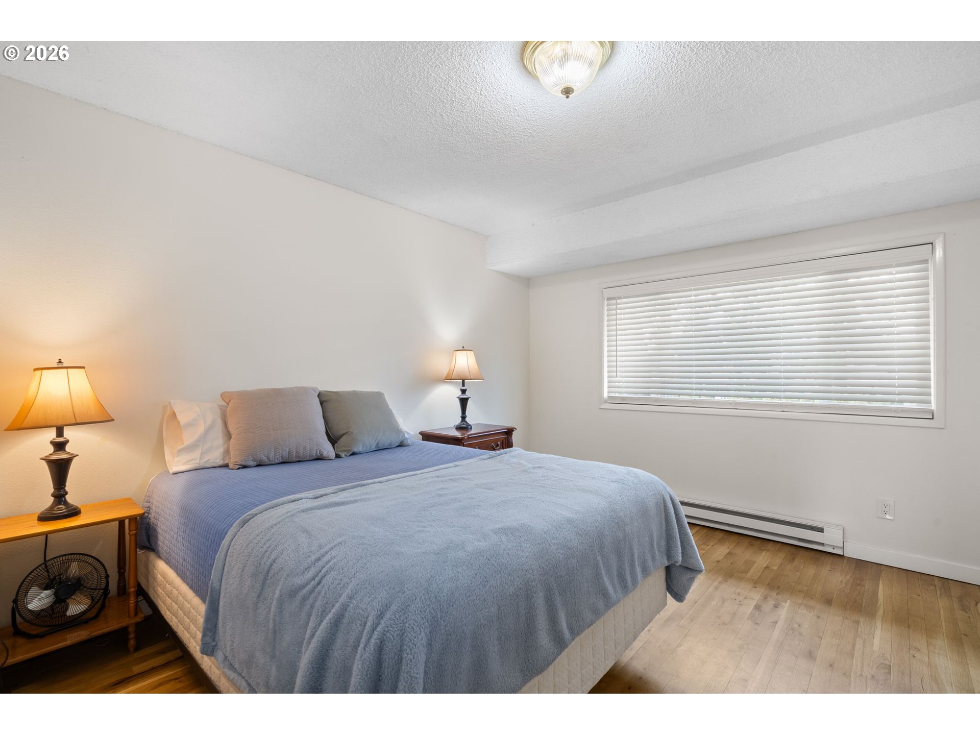 1773 Northeast 19th Street Gresham, OR 97030 - Photo 7 of 18 a bedroom with a bed and a night stand
