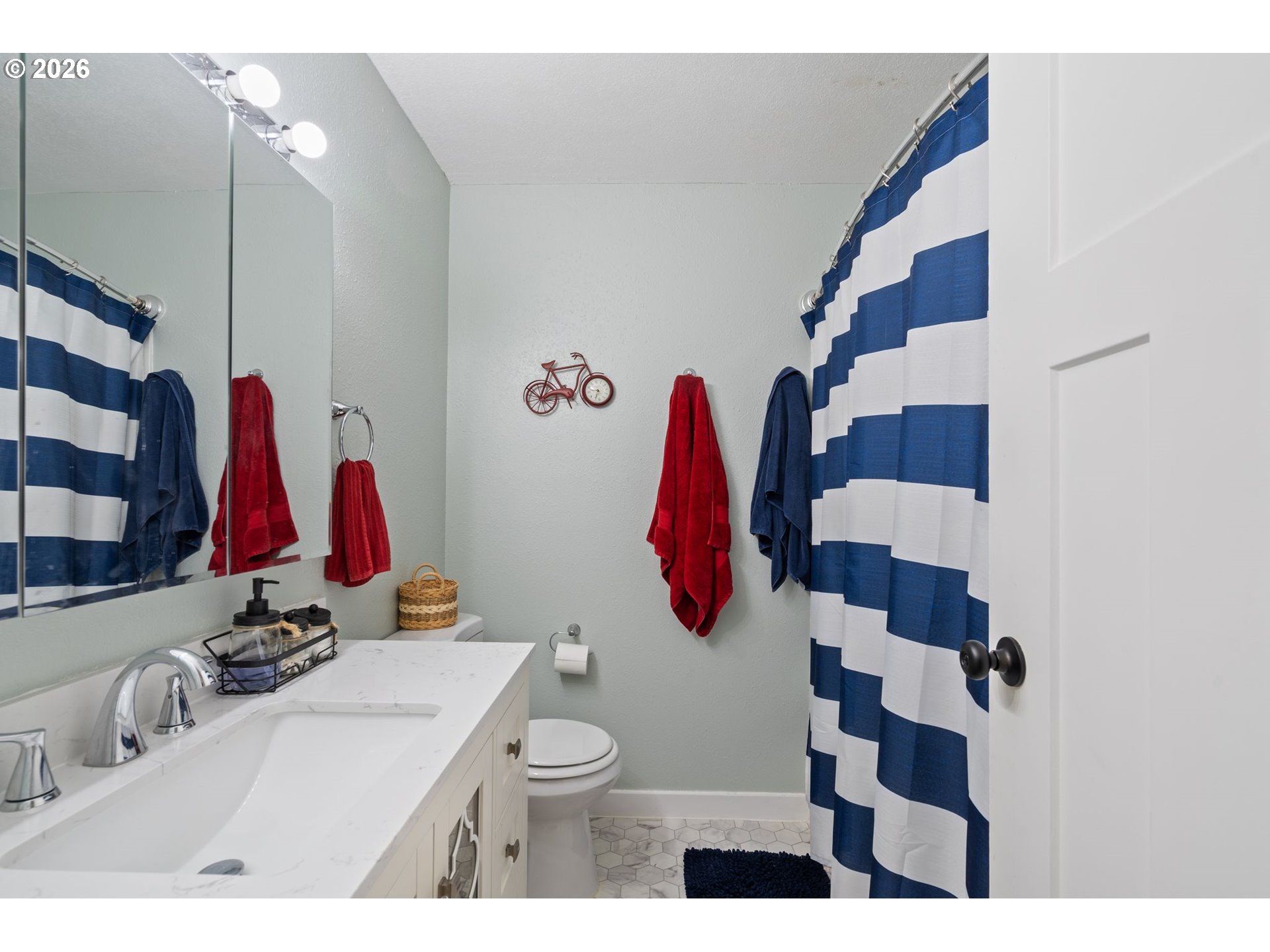1773 Northeast 19th Street Gresham, OR 97030 - Photo 8 of 18 a bathroom with a sink toilet and shower