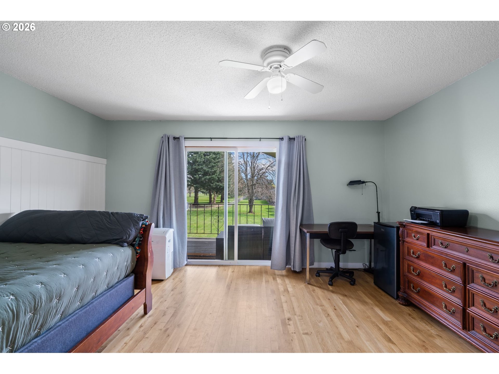 1773 Northeast 19th Street Gresham, OR 97030 - Photo 9 of 18 a bedroom with a bed and a desk