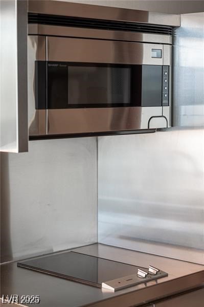 4381 West Flamingo Road, Unit 3303 Las Vegas, NV 89103 - Photo 30 of 37 Details featuring stainless steel microwave and black electric stovetop
