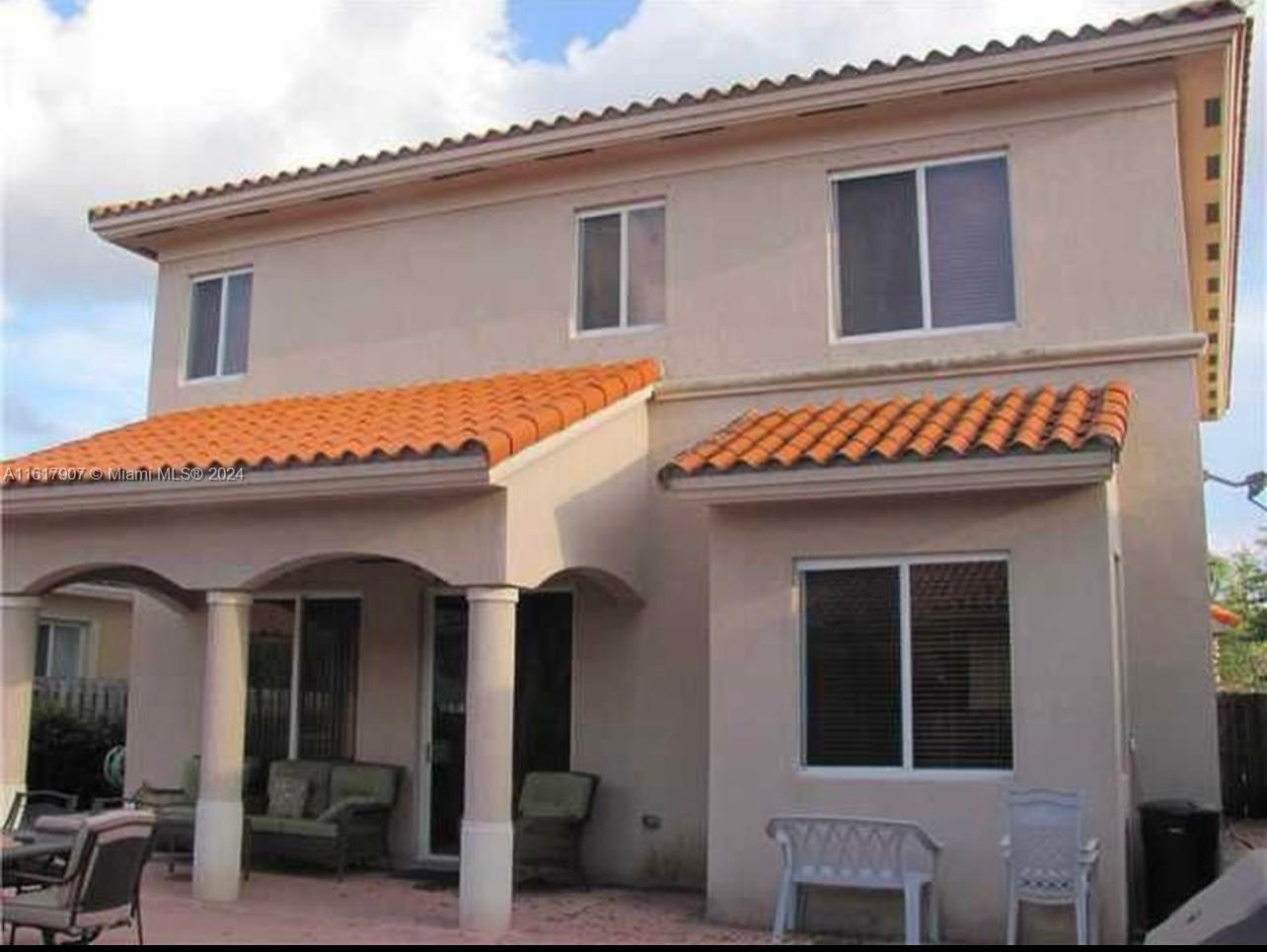 15259 Southwest 23rd Lane Miami, FL 33185 - Photo 4 of 10 a front view of a house