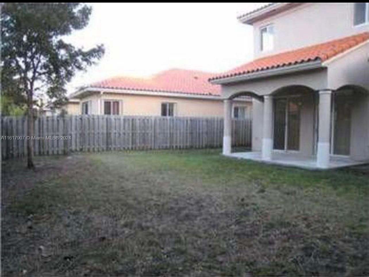 15259 Southwest 23rd Lane Miami, FL 33185 - Photo 6 of 10 a view of a house with a yard