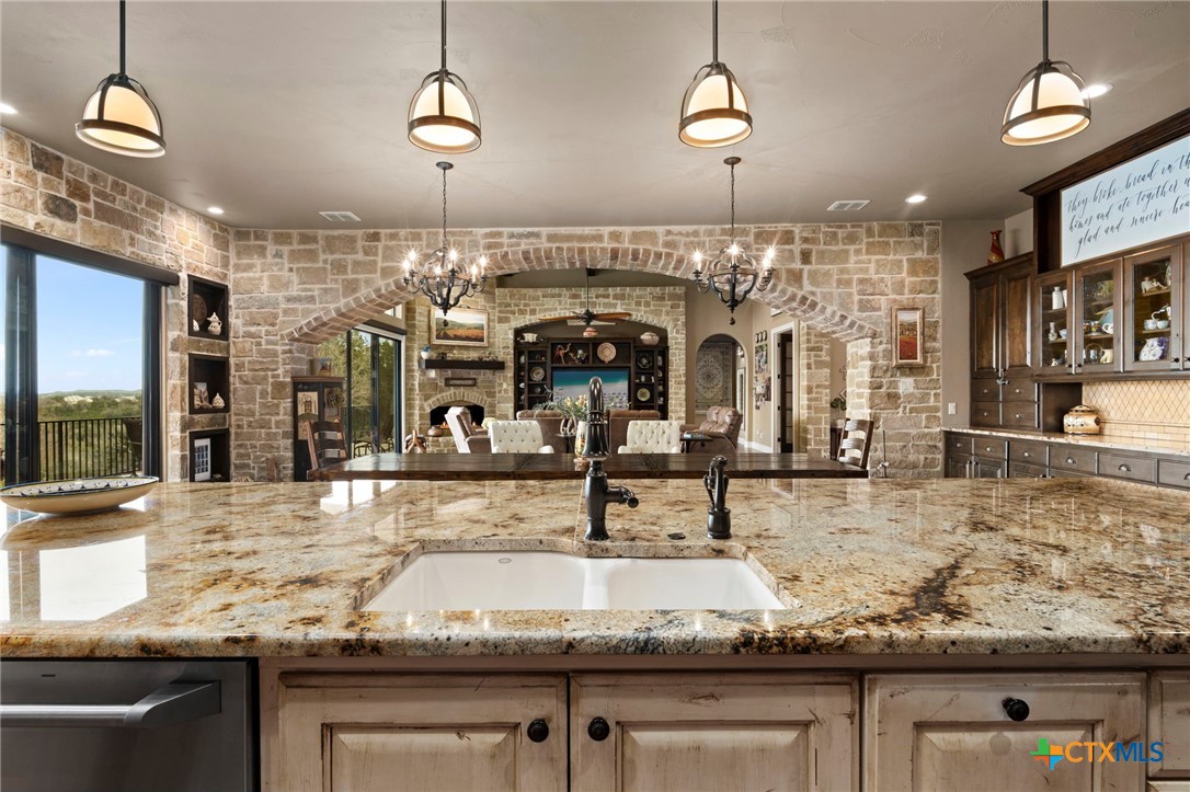 1039 Bluewater Place Spring Branch, TX 78070 - Photo 23 of 48 a view of a living room and kitchen