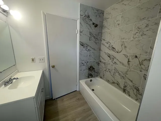 a bathroom with a sink and a bathtub