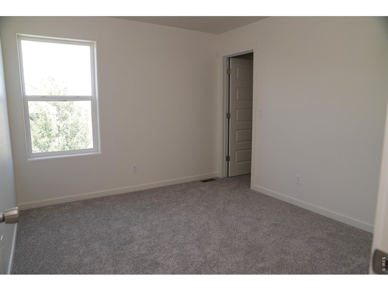 7905 West 11th St Road Greeley, CO 80634 - Photo 27 of 34 Bedroom 3 on upper level, walk-in closet