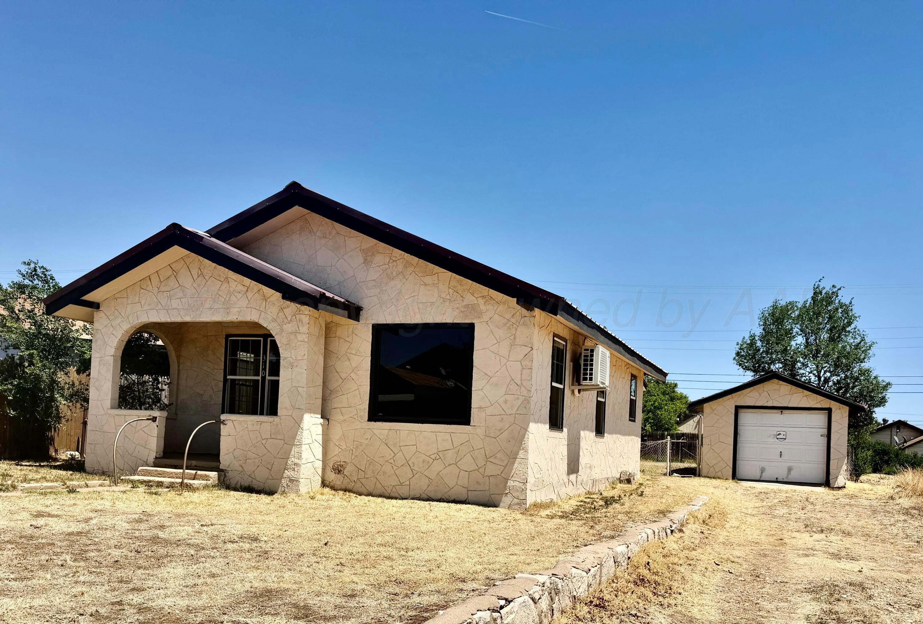 310 Coble Street Borger, TX 79007 - Photo 1 of 7 a view of a house with a yard