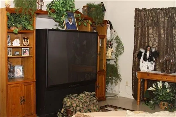 a bedroom with a bed and a window with the garden