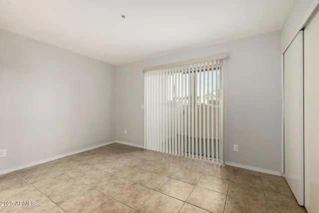 a bathroom with a granite countertop sink a toilet a mirror and shower