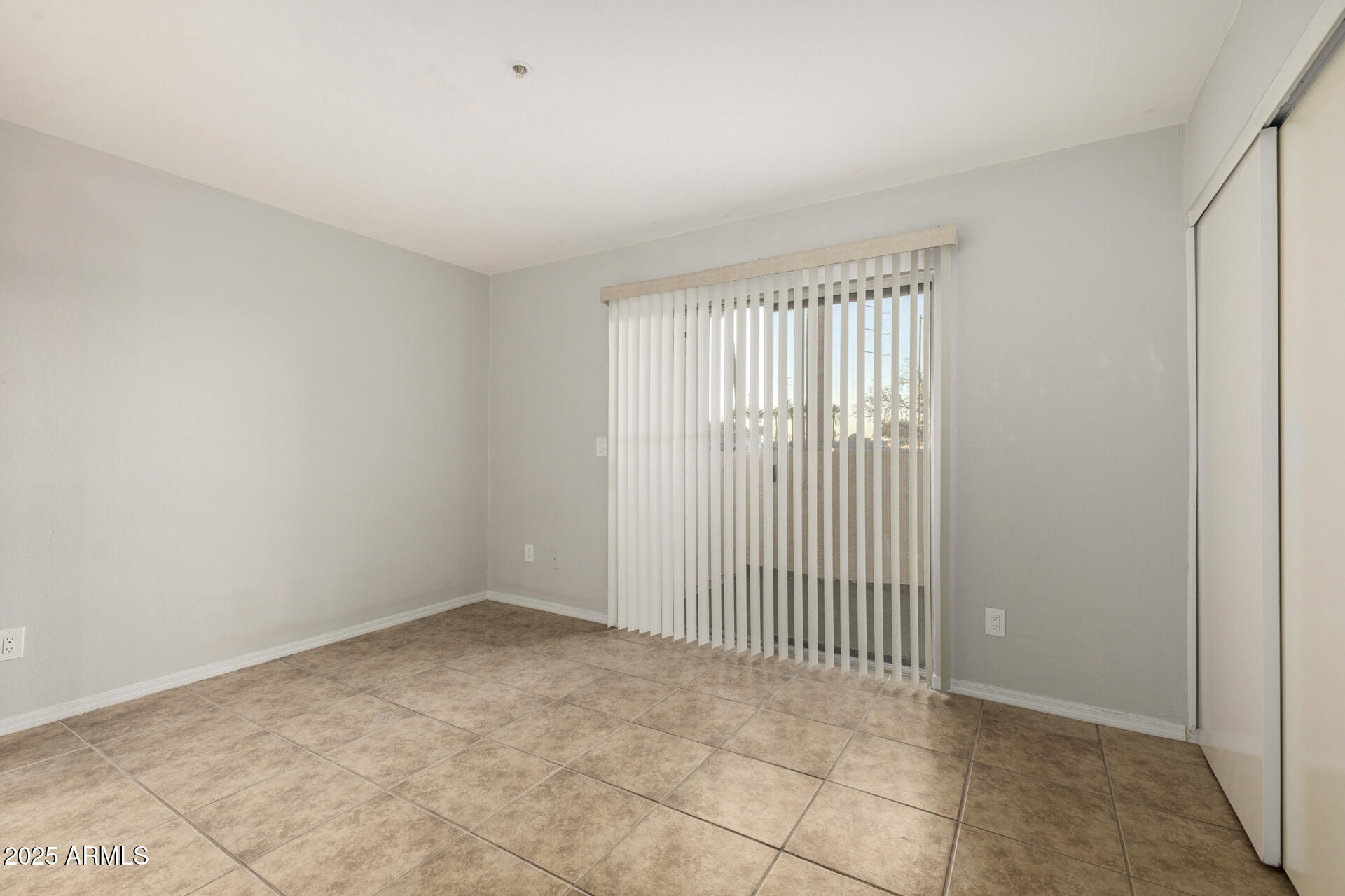 12123 West Bell Road, Unit 110 Surprise, AZ 85378 - Photo 15 of 27 an empty room with windows