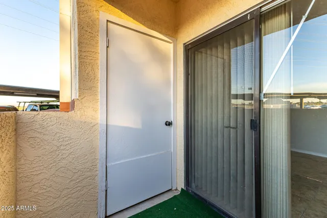 a backyard of a house with fire pit and couches