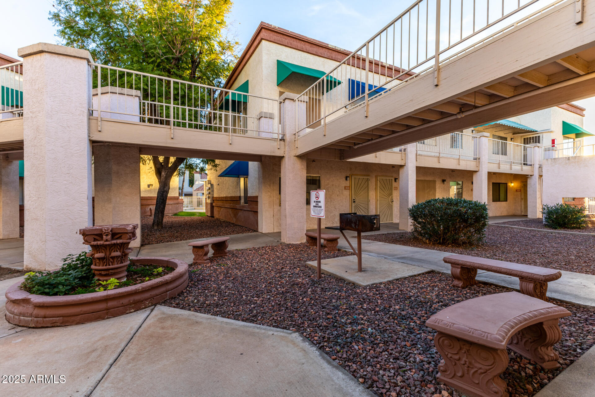 12123 West Bell Road, Unit 110 Surprise, AZ 85378 - Photo 21 of 27 a view of a house with backyard and sitting area