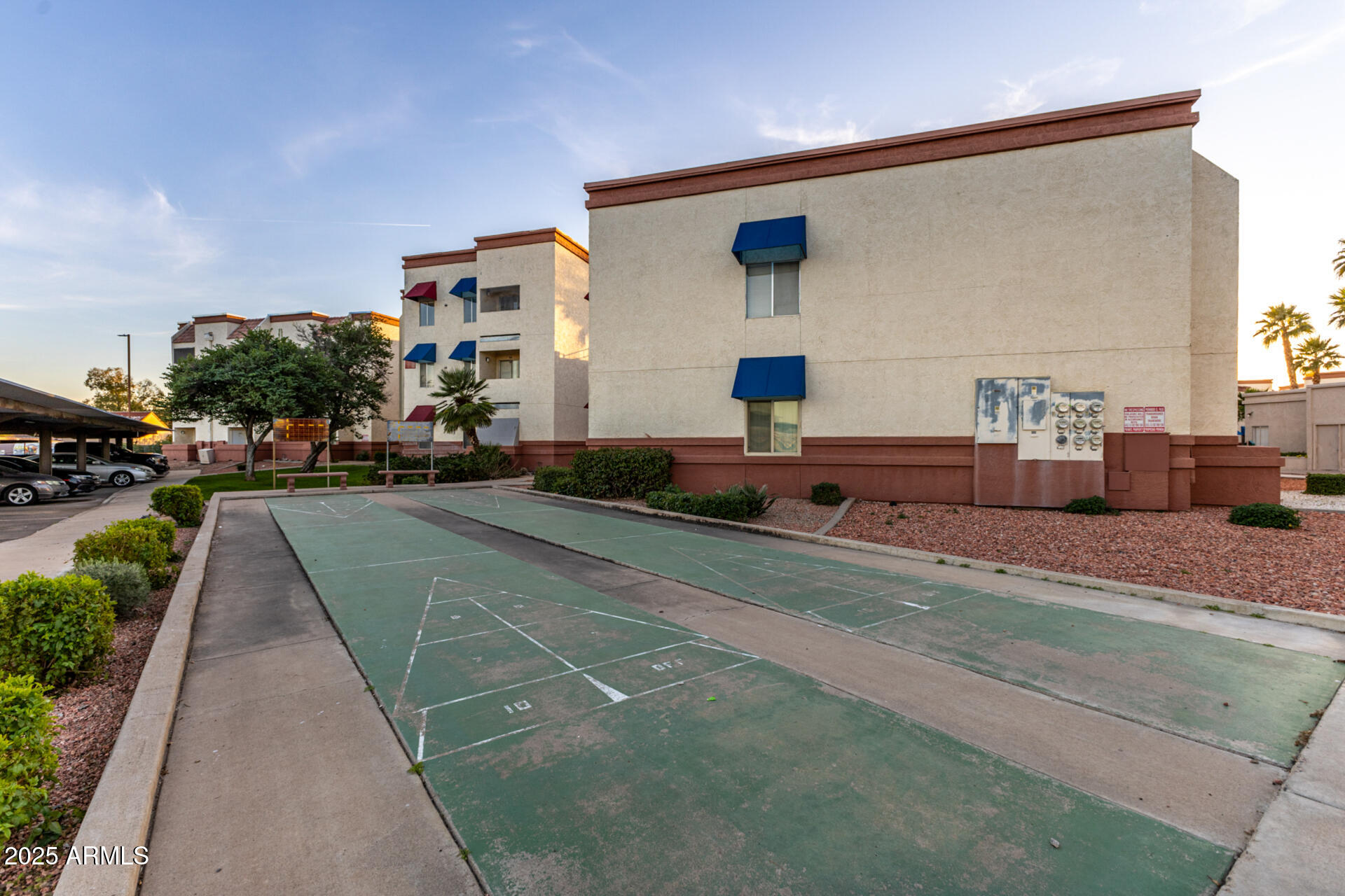 12123 West Bell Road, Unit 110 Surprise, AZ 85378 - Photo 24 of 27 a front view of a house with a yard