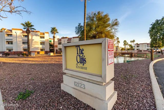 a view of a swimming pool with sitting area