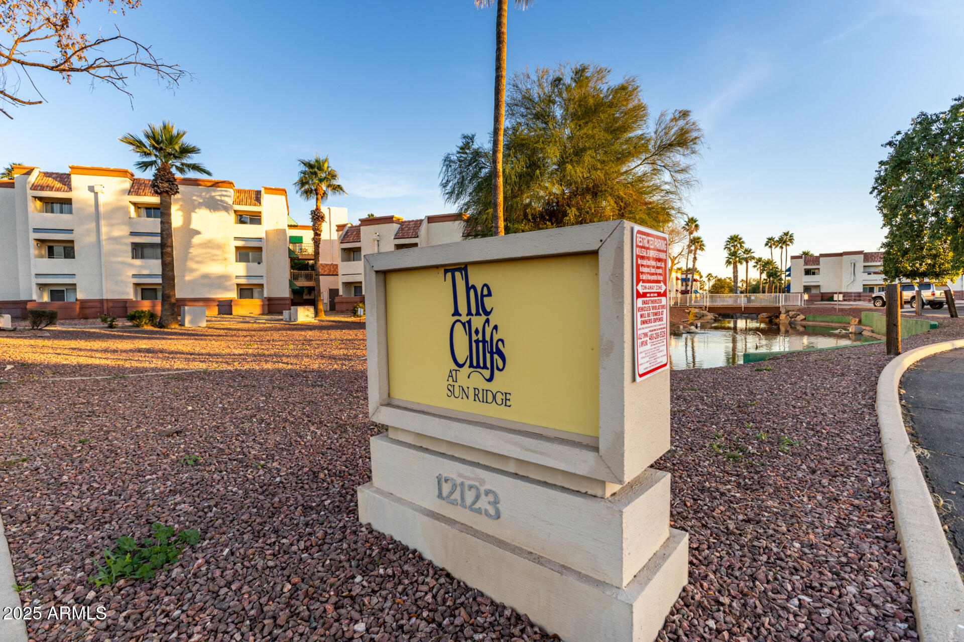 12123 West Bell Road, Unit 110 Surprise, AZ 85378 - Photo 25 of 27 a view of a street with cars on road