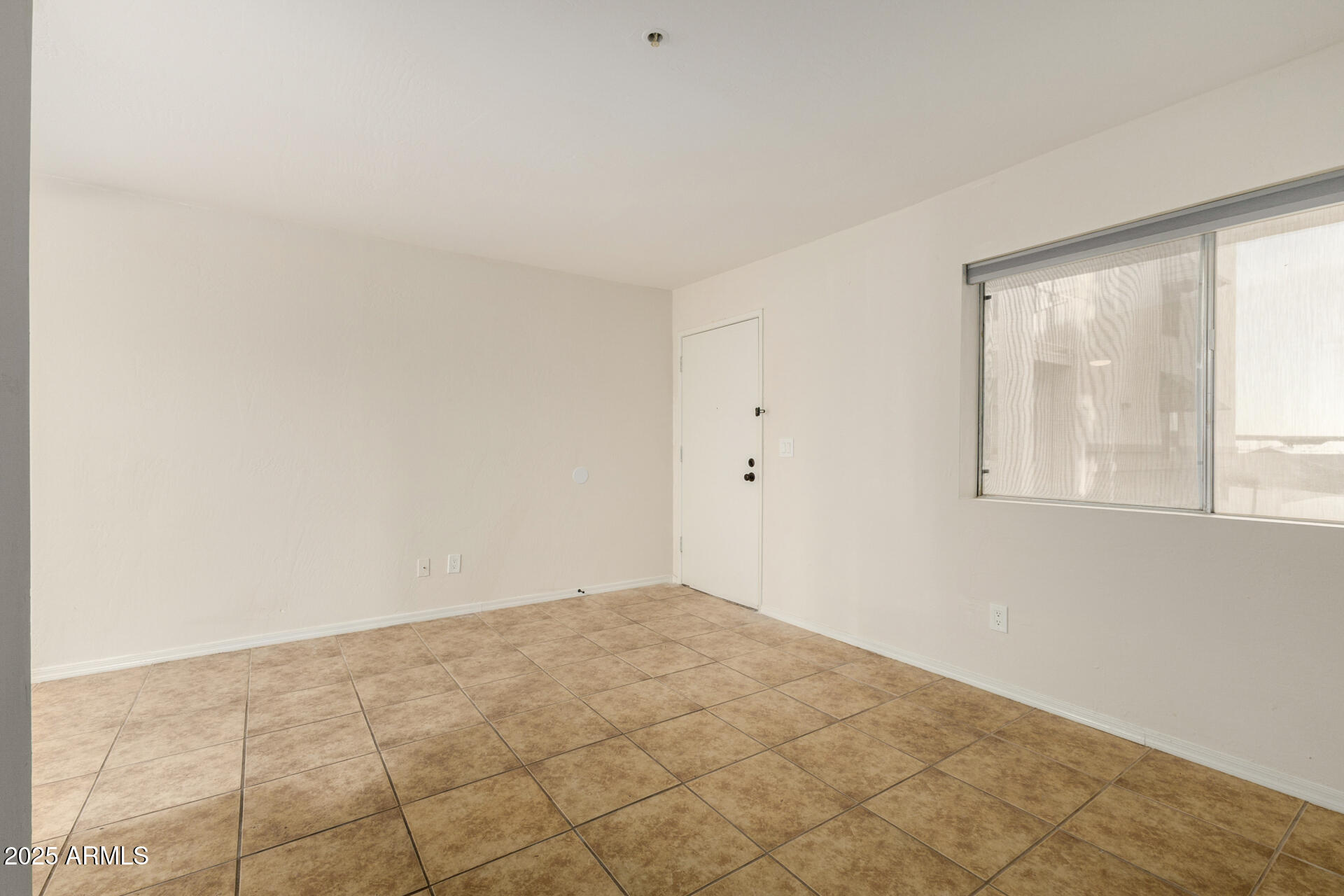 12123 West Bell Road, Unit 110 Surprise, AZ 85378 - Photo 4 of 27 an empty room with windows