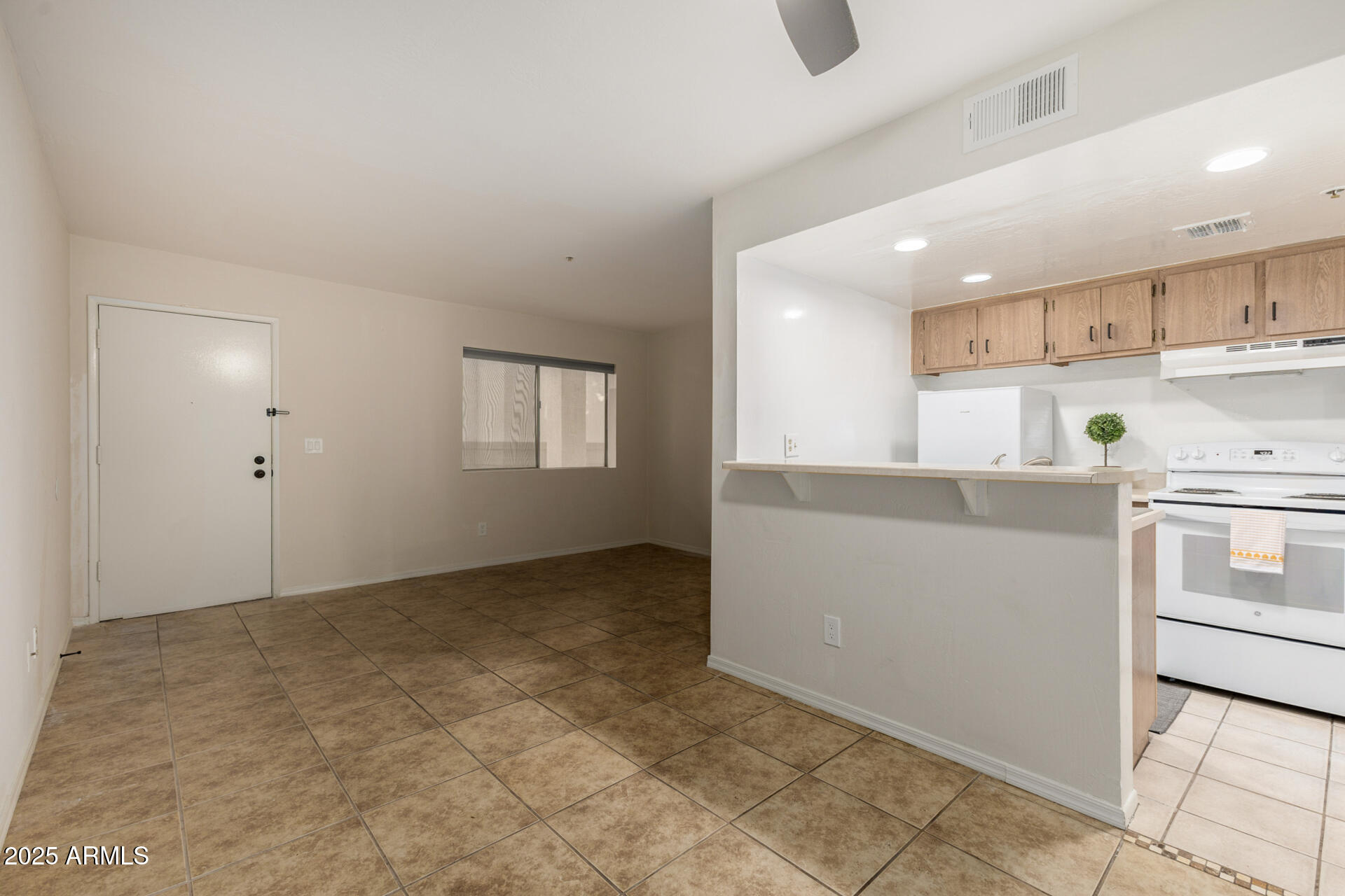12123 West Bell Road, Unit 110 Surprise, AZ 85378 - Photo 7 of 27 a view of kitchen with wooden floor