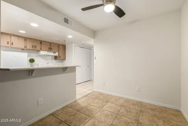 a kitchen with kitchen island a stove a sink and a refrigerator