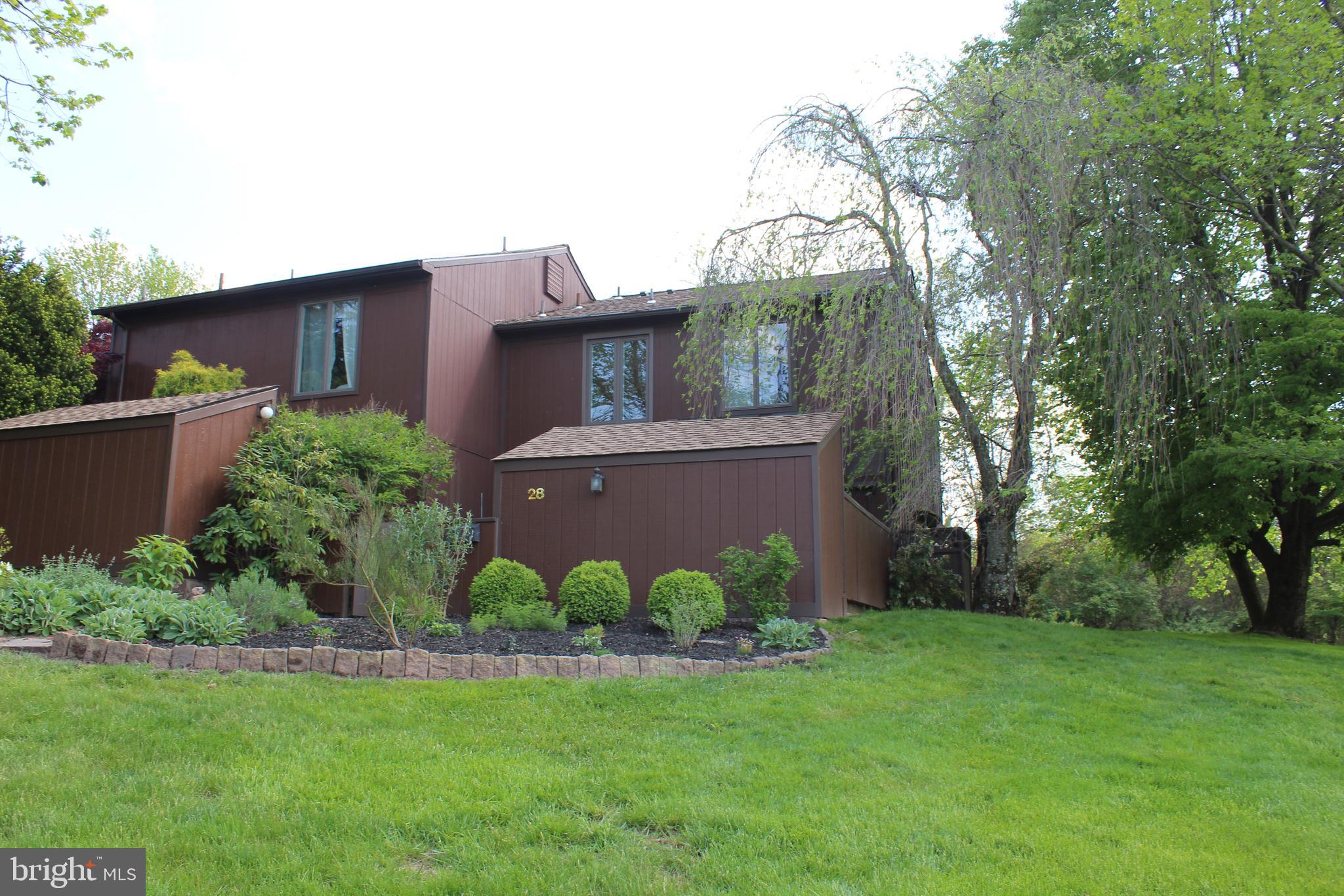 28 Eden Roc New Hope, PA 18938 - Photo 2 of 37 The exterior end-unit is surrounded by yard.