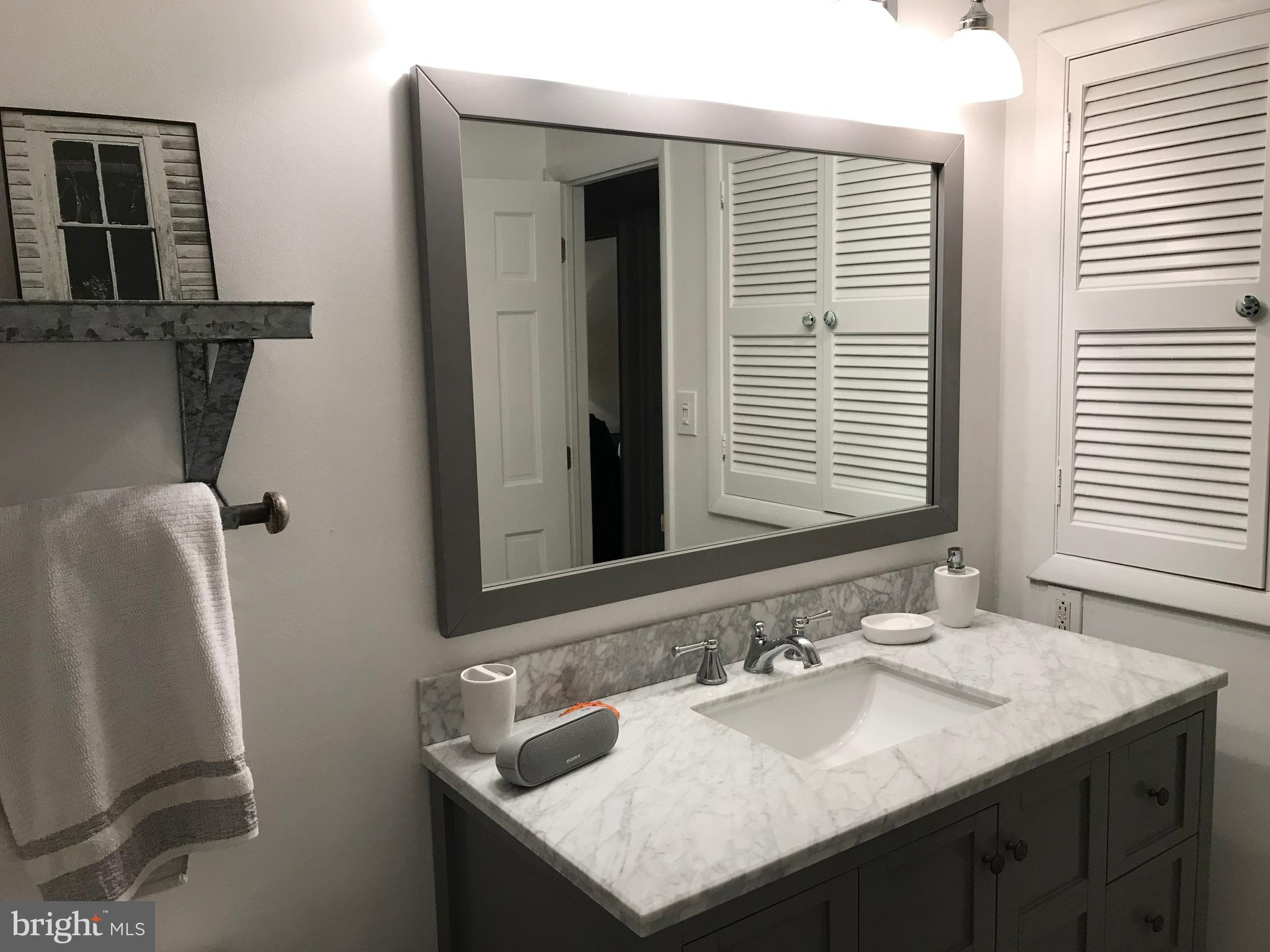 28 Eden Roc New Hope, PA 18938 - Photo 31 of 37 Hall bath with extra storage in built-in cabinet