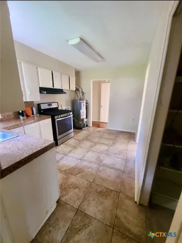 a large living room with a couch