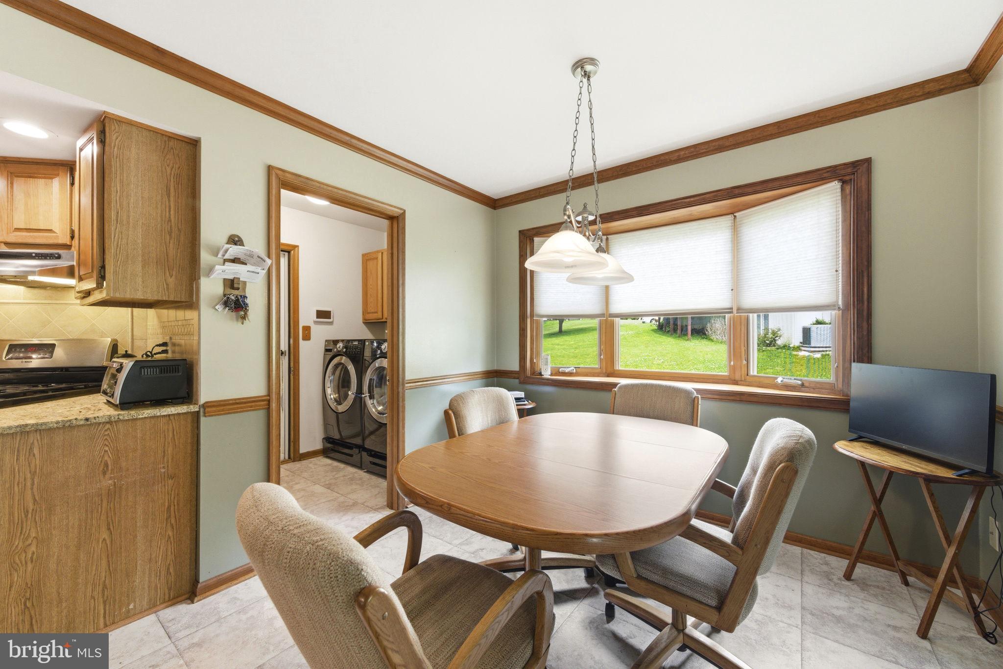 736 Letitia Drive Hockessin, DE 19707 - Photo 36 of 92 a dining room with furniture window wooden floor