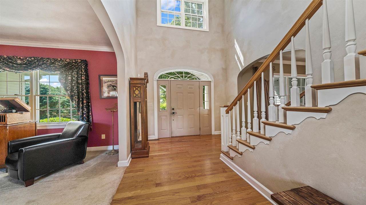4464 Ridgeview Lane Byron, IL 61010 - Photo 6 of 54 a view of an entryway with wooden floor and windows